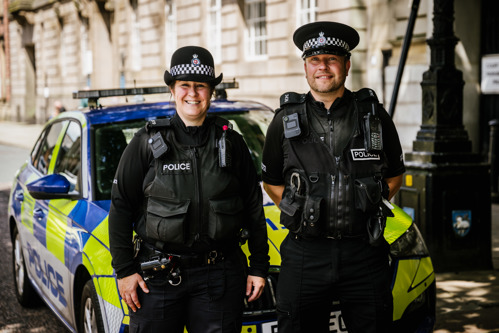 Two police officers on a visible patrol in Preston city centre